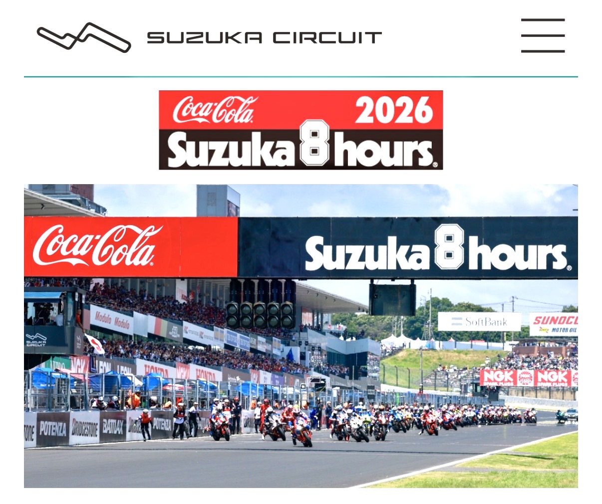 Suzuka Circuit race start: row of racing motorcycles on the track under a Coca-Cola Suzuka 8 Hours banner.